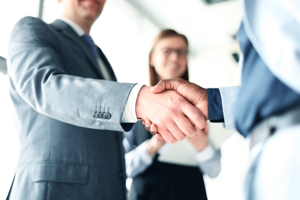 Attorney Shaking Hands with Client