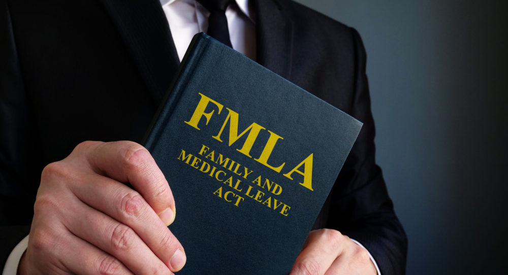 Attorney Holding FMLA Book